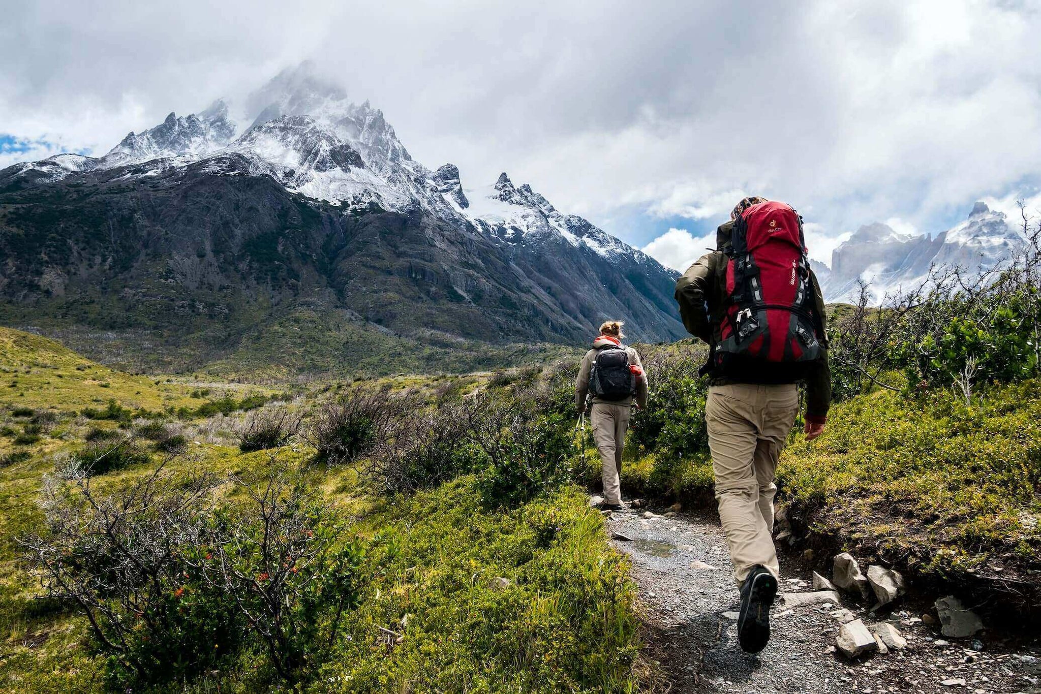 Toe socks benefits include helping two hikers trek across rough terrain