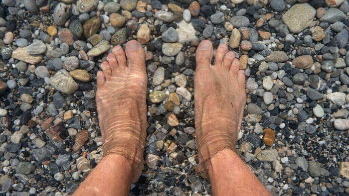 Man feet under water